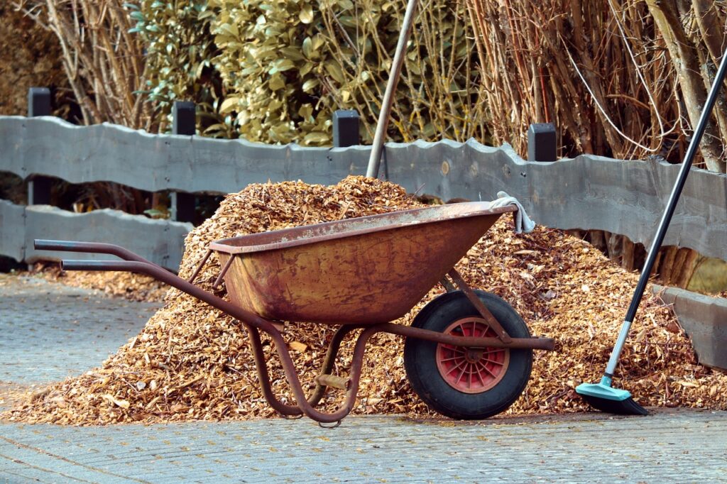 Mulch collected near a wheelbarrow
