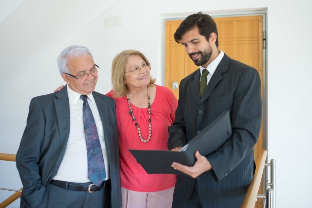Real Estate Agent talking to an Elderly Couple